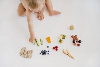 high angle baby choosing what eat alone